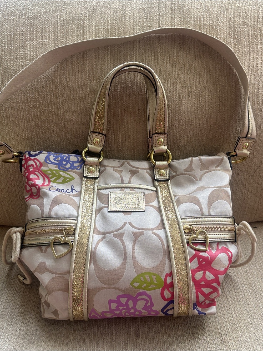Coach Beige Signature Satchel with Multicolor Floral Accents and Gold Trim